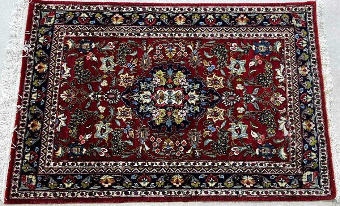 Lachak Toranj design Persian rug, central medallion and corner motifs