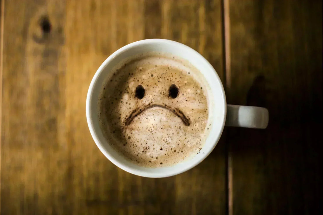 sad coffee cup, coffee with sad face, unhealthy coffee habit, caffeine addiction symbol, coffee and depression, emotional coffee image, negative coffee effects, coffee regret concept, sad face latte art, coffee health warning, symbolic coffee image